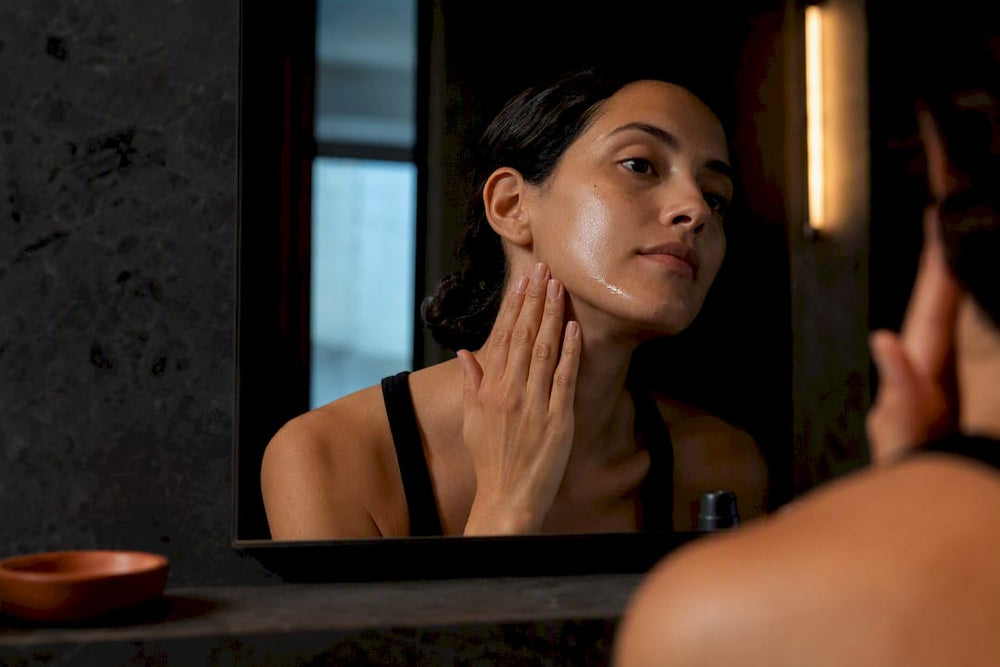 Person applying serum during evening skincare routine
