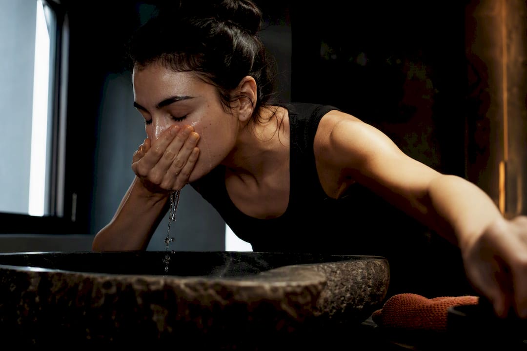 Person performing a simple two-step skincare routine